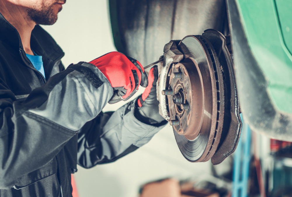 Mechanic Repairing A Vehicle Brake