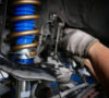 Mechanic Upgrading Suspension of A Vehicle