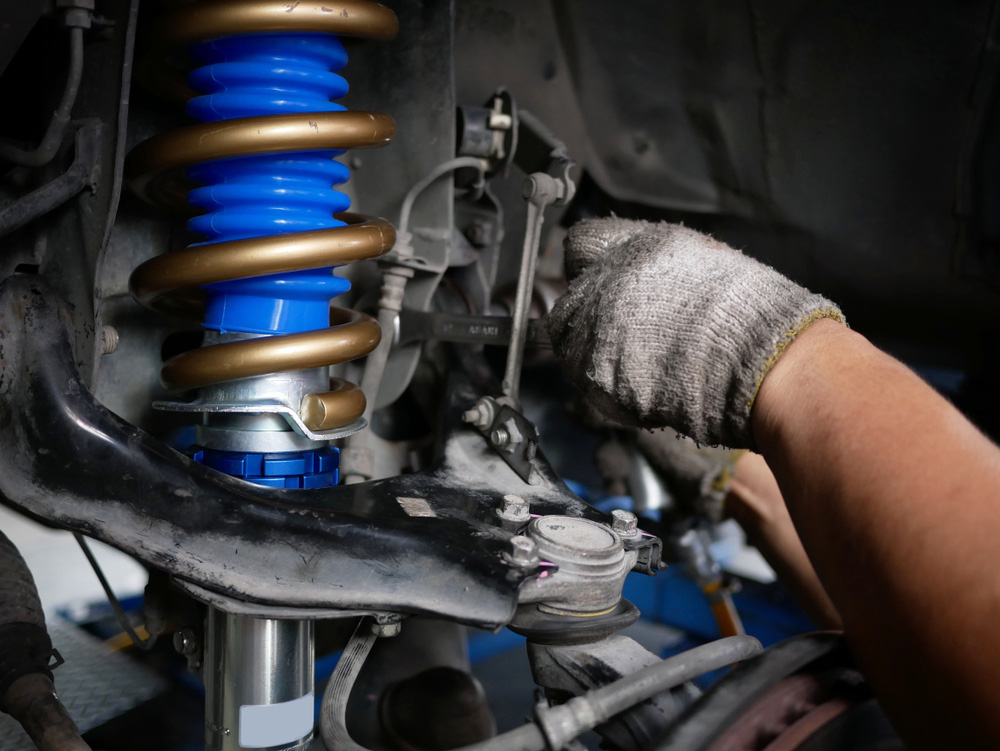 Mechanic Upgrading Suspension of A Vehicle